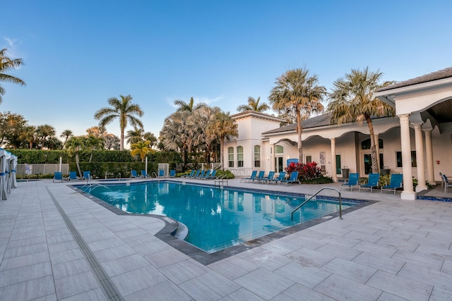 view of swimming pool with a patio