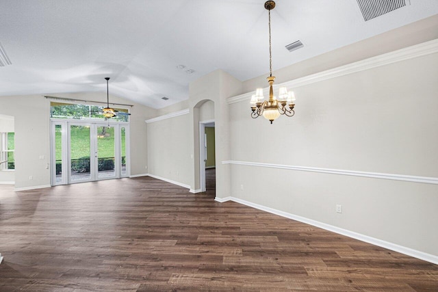 empty room featuring lofted ceiling, visible vents, baseboards, arched walkways, and a notable chandelier