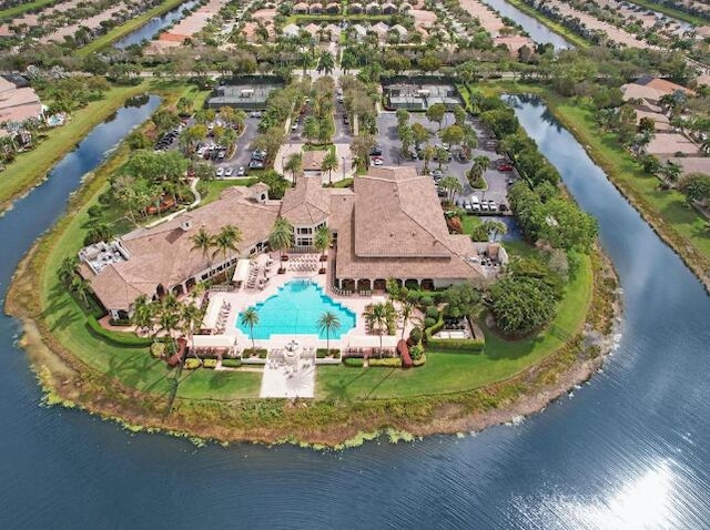 birds eye view of property featuring a water view