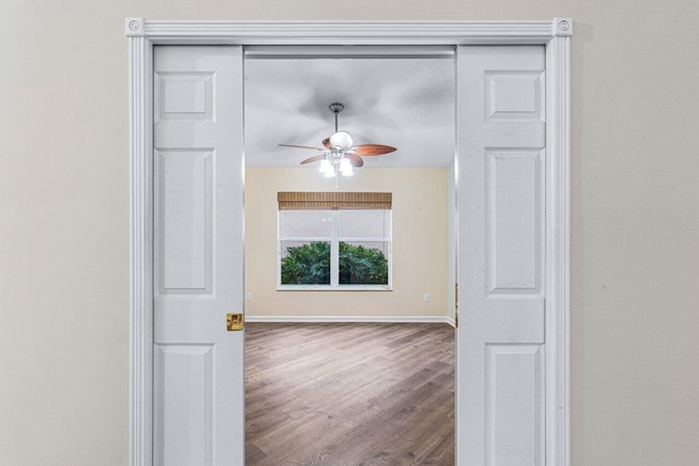 spare room featuring hardwood / wood-style flooring and ceiling fan