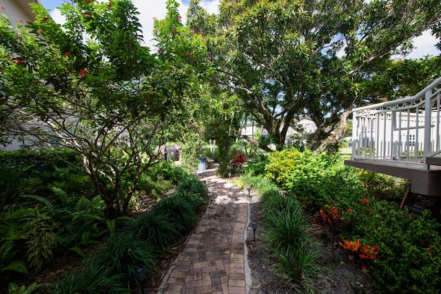 view of yard with a balcony