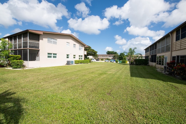 view of yard with central AC