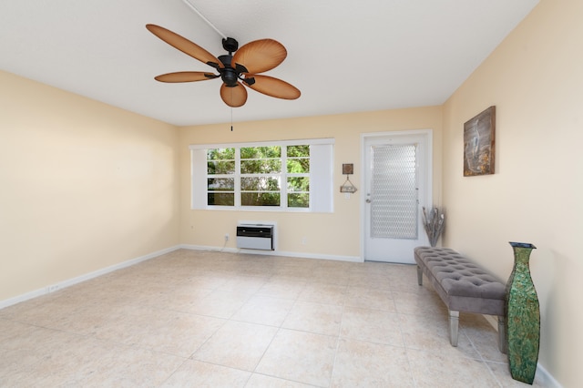 interior space featuring ceiling fan, heating unit, and light tile patterned floors