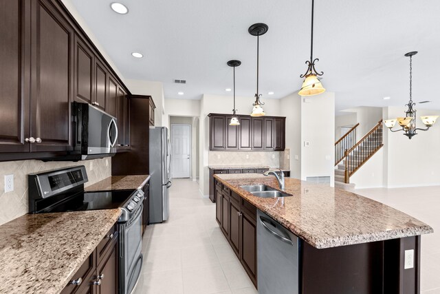 entryway featuring a chandelier, a wealth of natural light, and light colored carpet