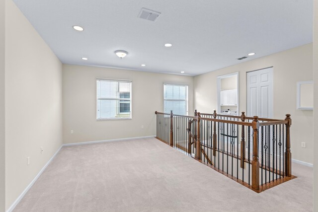 stairs featuring tile patterned floors and a healthy amount of sunlight