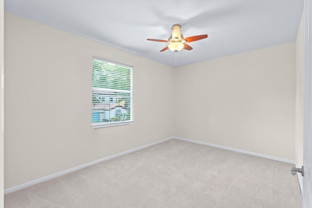 spare room featuring light tile patterned floors and a notable chandelier