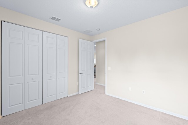 unfurnished living room with light tile patterned flooring and an inviting chandelier