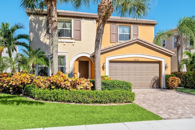 mediterranean / spanish-style house featuring a garage