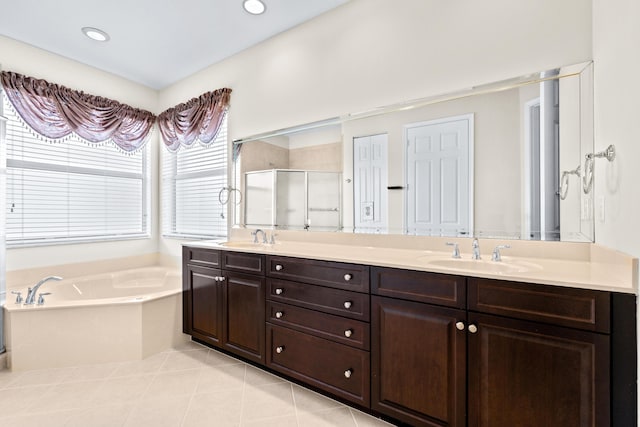 bathroom featuring tile patterned flooring, shower with separate bathtub, vanity, and plenty of natural light