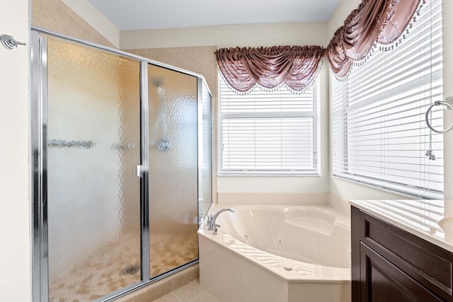 bathroom featuring separate shower and tub, tile patterned flooring, and vanity