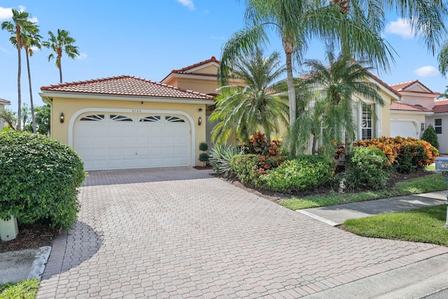 mediterranean / spanish-style house featuring a garage