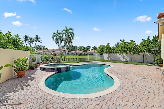 view of swimming pool featuring central AC unit, an in ground hot tub, and a patio