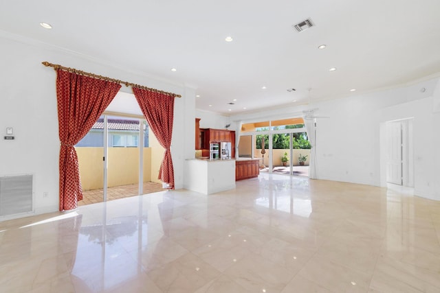 unfurnished living room with ornamental molding