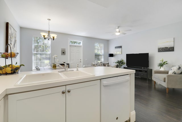 kitchen with white cabinets, ceiling fan with notable chandelier, white dishwasher, and sink