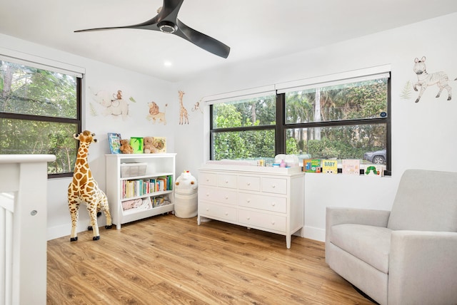 interior space featuring light wood-type flooring and ceiling fan