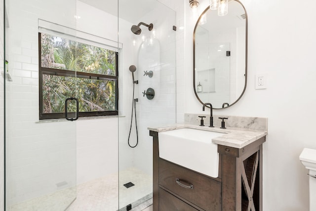 bathroom with vanity and an enclosed shower