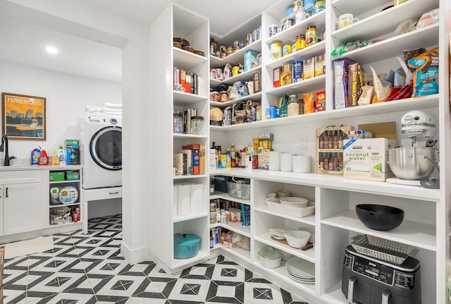 pantry featuring washer / dryer and sink