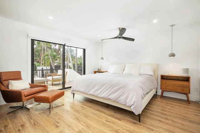 bedroom featuring light hardwood / wood-style flooring, access to outside, and ceiling fan