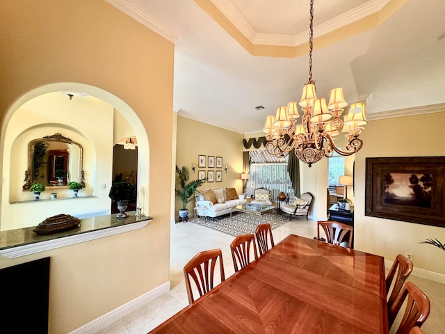 dining area featuring crown molding, light tile patterned flooring, and an inviting chandelier