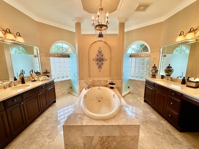 bathroom with vanity, a healthy amount of sunlight, and separate shower and tub