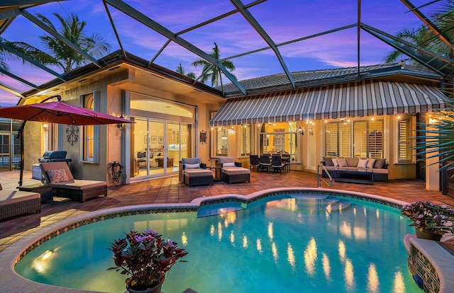 pool at dusk featuring french doors, an outdoor living space, a patio area, and a lanai