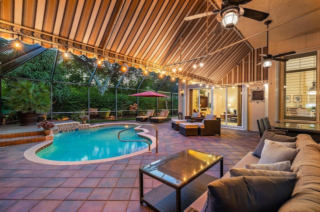 view of pool with a patio, an outdoor hangout area, a lanai, and ceiling fan