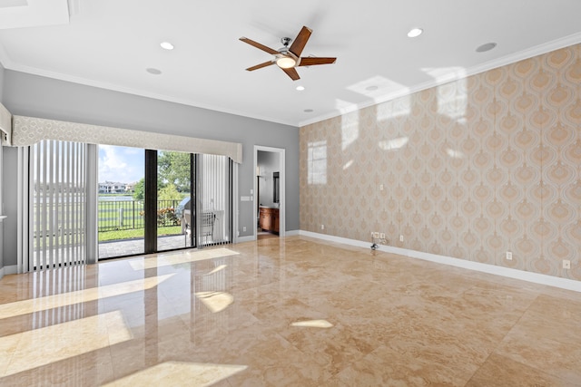 spare room featuring crown molding and ceiling fan