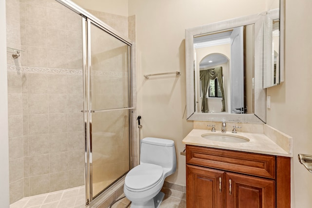 bathroom with vanity, toilet, and walk in shower