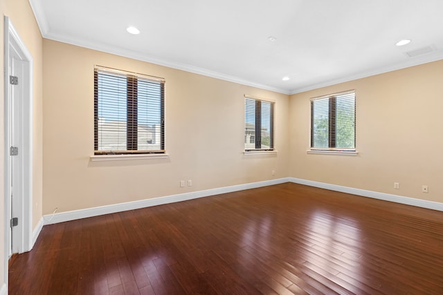 unfurnished room featuring hardwood / wood-style flooring and ornamental molding