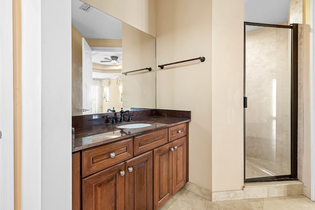 bathroom with vanity, ceiling fan, tile patterned floors, and walk in shower