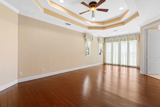 spare room featuring crown molding, hardwood / wood-style flooring, and ceiling fan