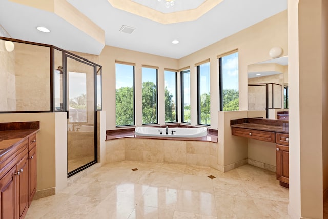 bathroom featuring vanity and plus walk in shower