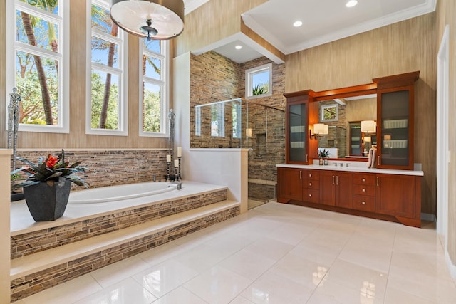 bathroom with tile patterned flooring, vanity, a wealth of natural light, ornamental molding, and shower with separate bathtub