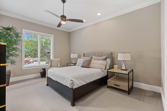 carpeted bedroom with crown molding and ceiling fan