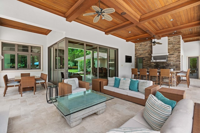 view of patio featuring an outdoor living space, an outdoor bar, and ceiling fan