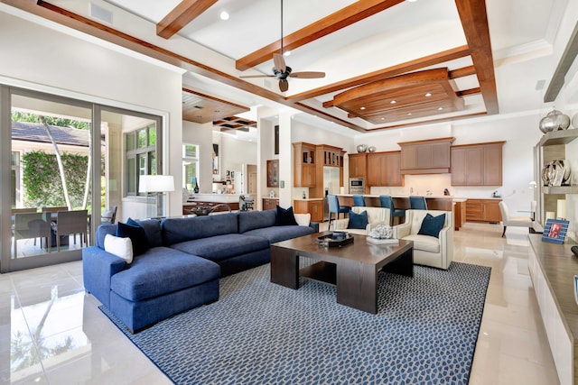 tiled living room featuring ceiling fan, beam ceiling, a towering ceiling, coffered ceiling, and ornamental molding