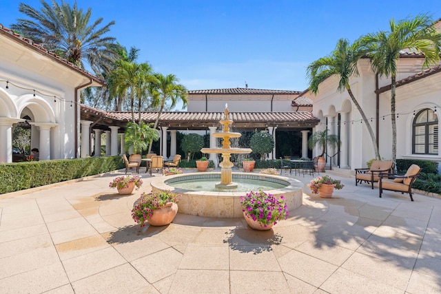 view of property's community with a patio area