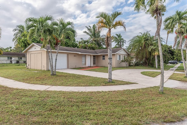 view of front of home featuring a front lawn and a garage