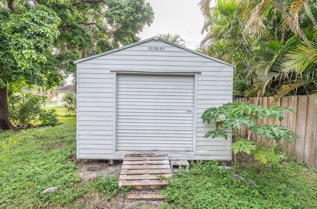 view of outbuilding featuring a lawn