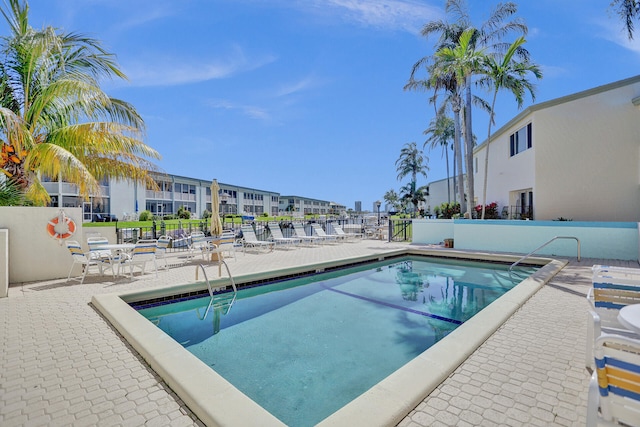 view of swimming pool featuring a patio area