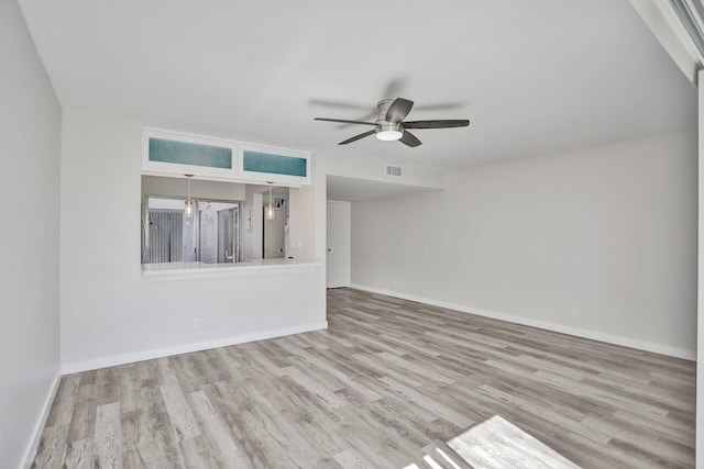 unfurnished living room featuring light hardwood / wood-style flooring and ceiling fan