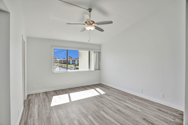 spare room with light wood-type flooring and ceiling fan