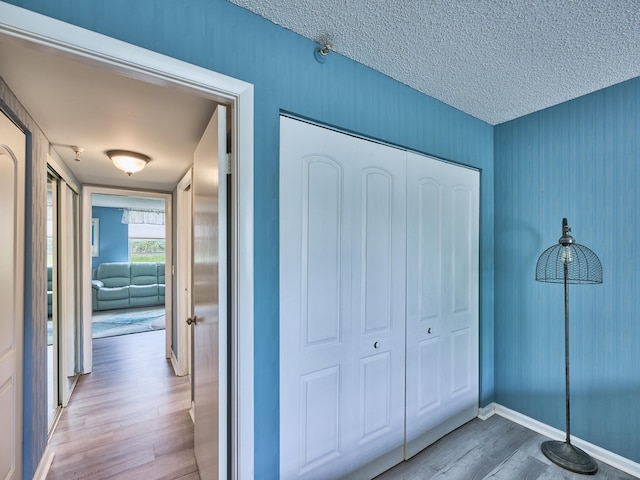 interior space with hardwood / wood-style floors and a textured ceiling