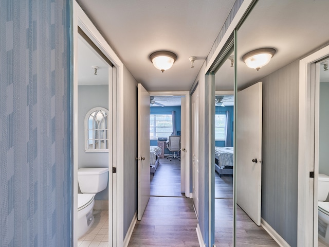 corridor featuring light hardwood / wood-style flooring