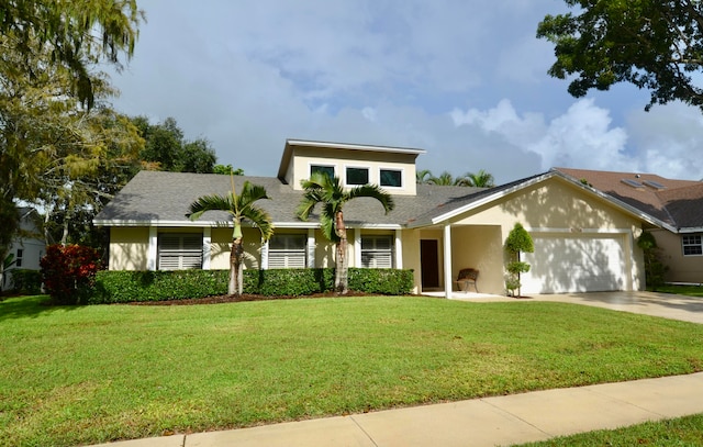 view of front facade featuring a front yard and a garage