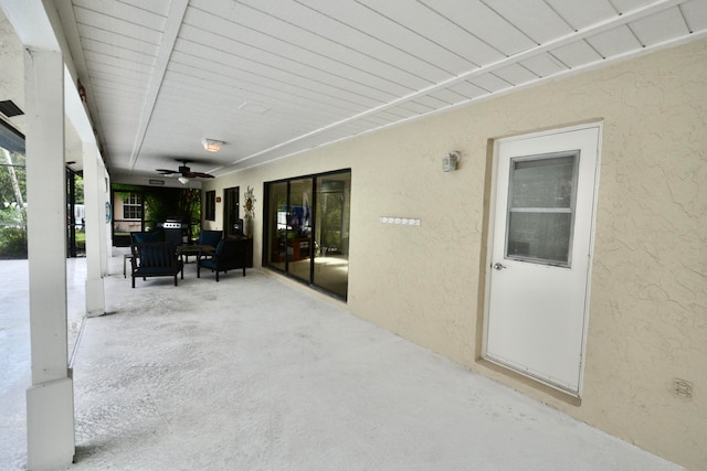 view of patio featuring ceiling fan