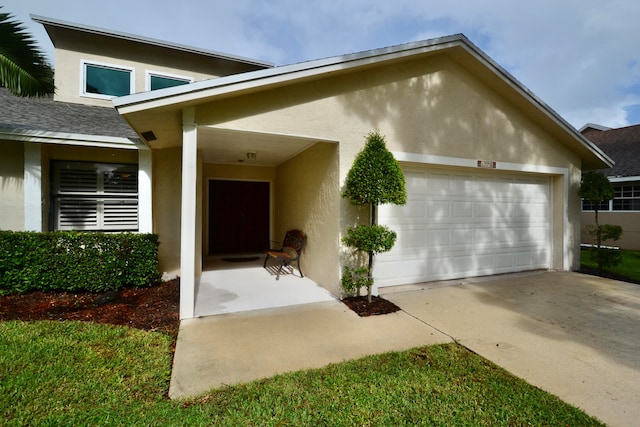 doorway to property featuring a garage