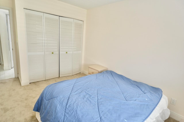 carpeted bedroom featuring a closet