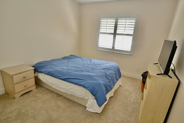 bedroom with light carpet