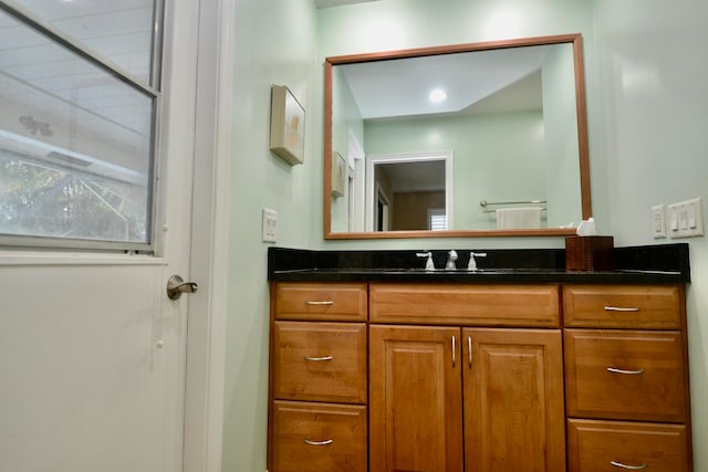 bathroom featuring vanity and walk in shower